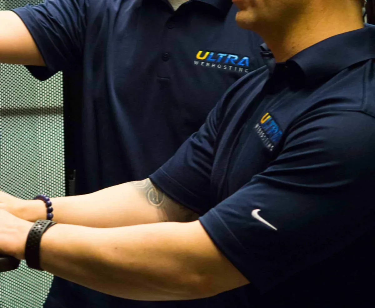 Ultra Web Hosting staff working hands-on with servers in the Tukwila facility
